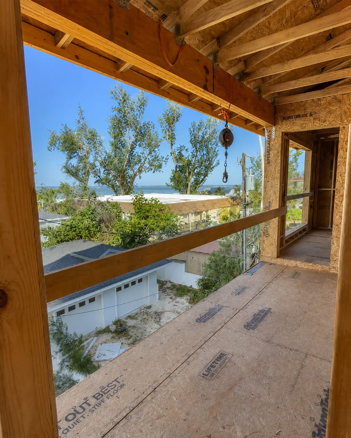 Window rough opening framed by Acosta Builders in Bradenton, FL — header, king and jack studs squared and sheathed, ready for an impact-rated unit